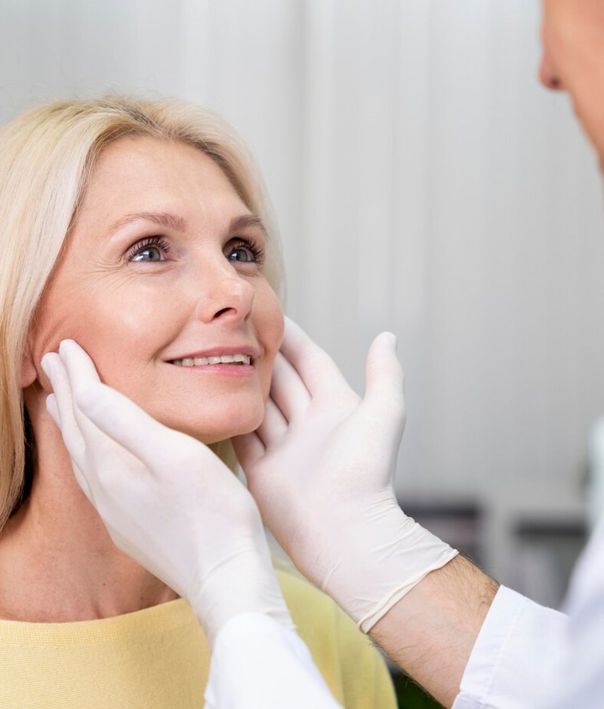 close-up-doctor-checking-patient_23-2149103552 Smiling Woman Receiving Professional Skin Consultation for Antiaging Treatments – Before and After Gallery